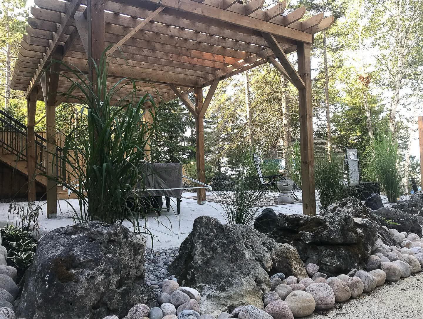 French drain installation yard drainage Barrie Ontario perforated pipe gravel trench